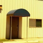 Half round awning over a door.