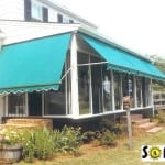 Sunroom with retractable awnings.