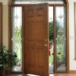 Glass door with a half circle transom and sidelights.