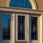 Glass door with a half circle transom and sidelights.